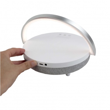Logotrade Werbegeschenke das Foto: Prixton 10W 4-in-1 Bluetooth®-Lautsprecher mit LED-Licht und kabelloser Ladestation